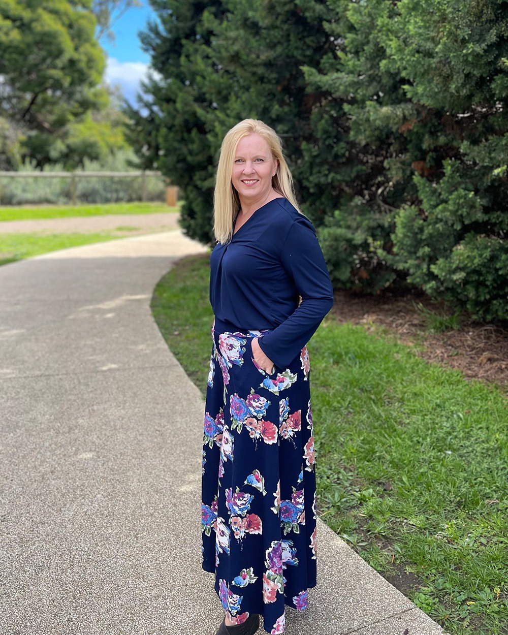 Janine Langley standing on a path in a park